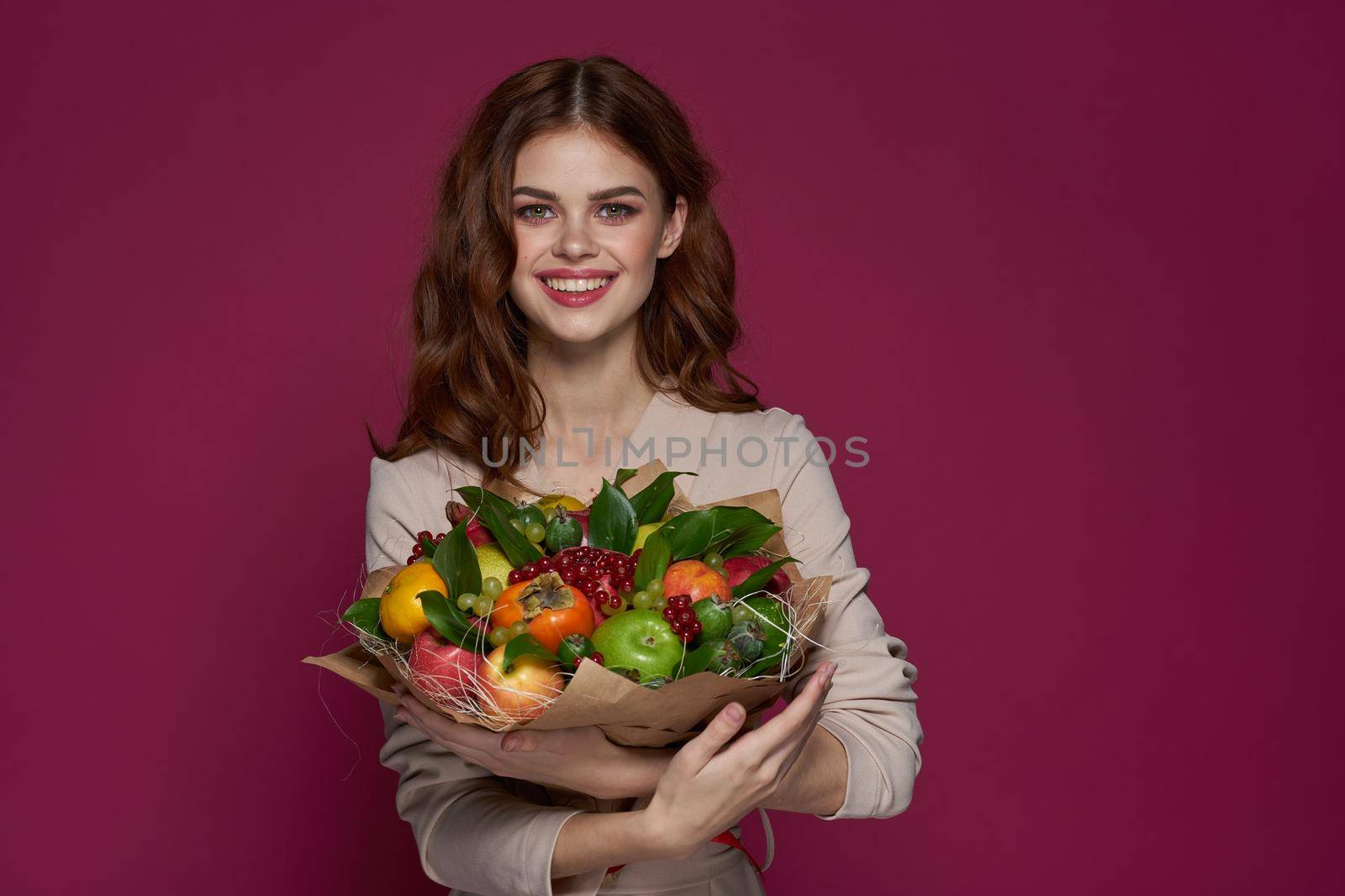 cheerful woman fun posing fruit bouquet vitamins isolated background by Vichizh