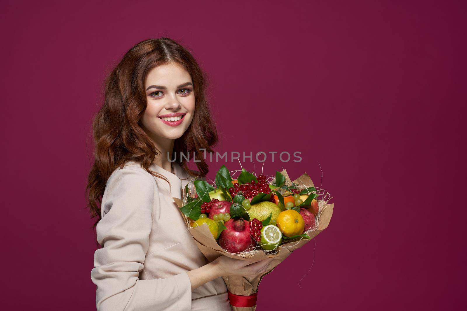 beautiful woman fun posing fruit bouquet vitamins isolated background. High quality photo