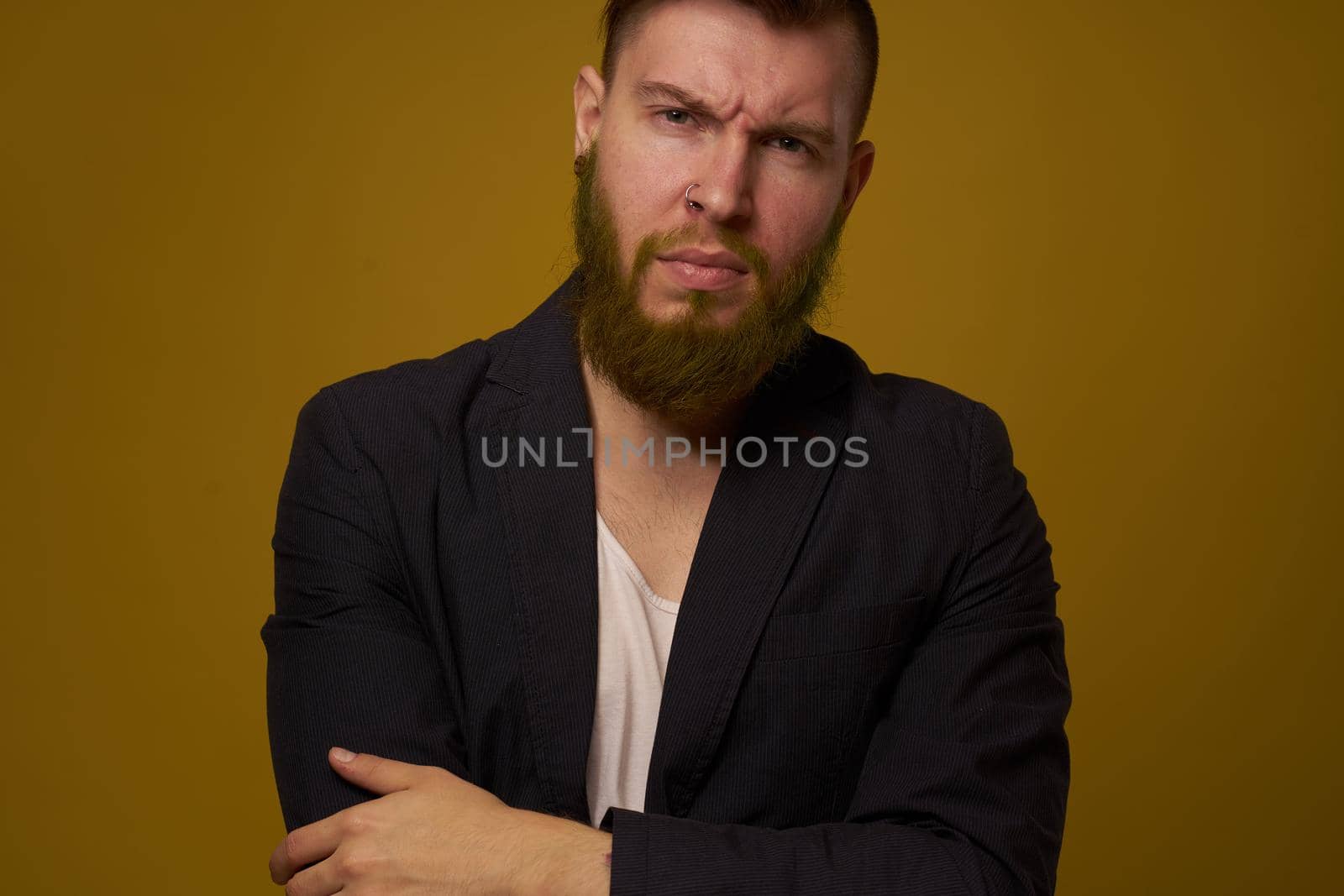 dealing with a serious expression in a black jacket emotions. High quality photo