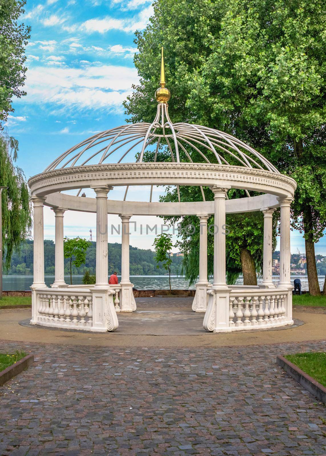 Ternopil, Ukraine 06.07.2021. Gazebo on the lovers island of Ternopil pond in Ukraine on a summer morning