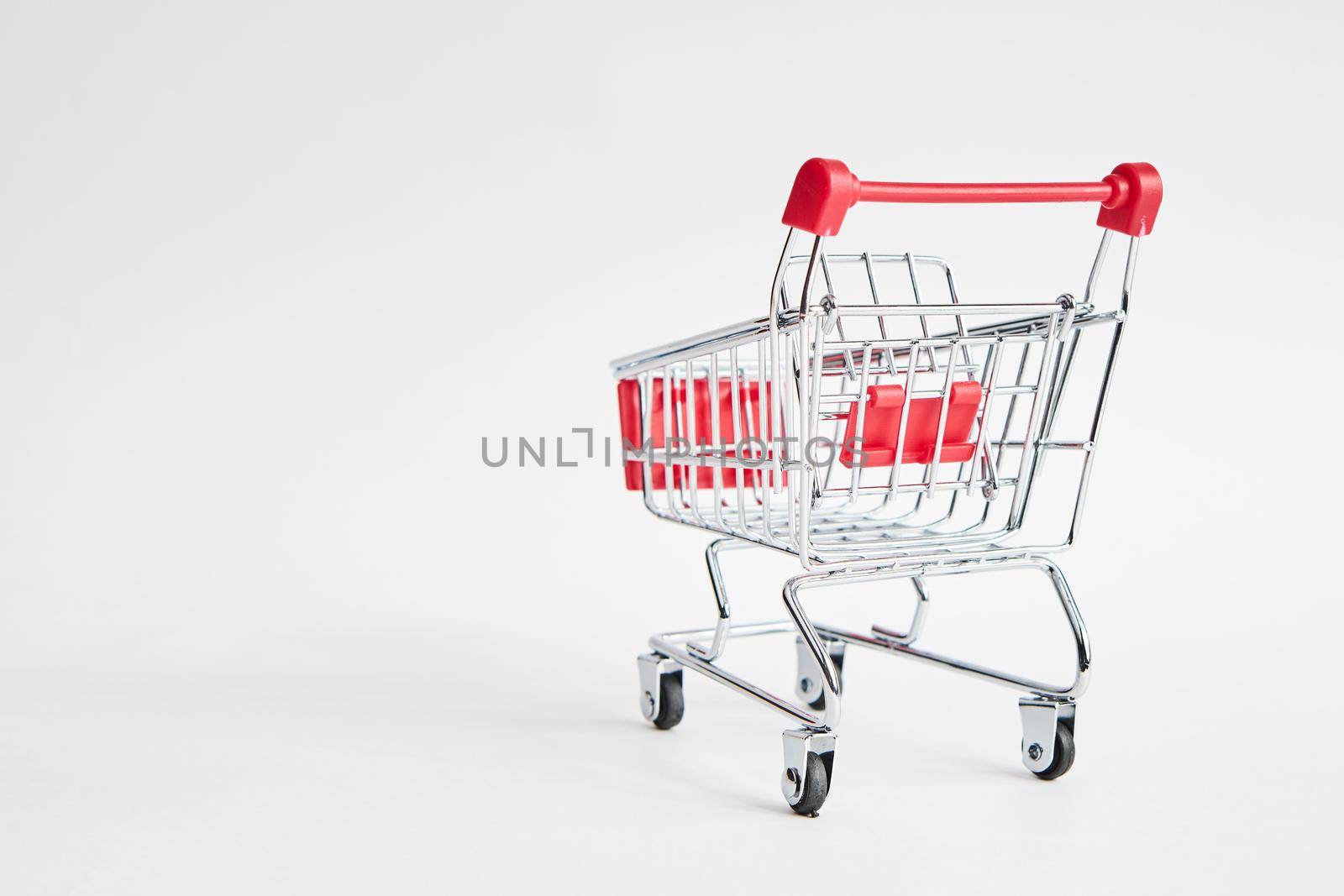 empty trolley on light background shopping supermarket service. High quality photo