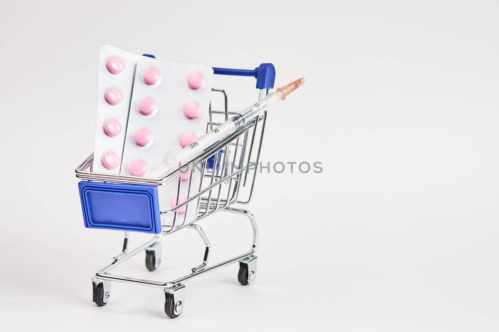 drug trolleys pharmacy shopping light background pharmacy. High quality photo