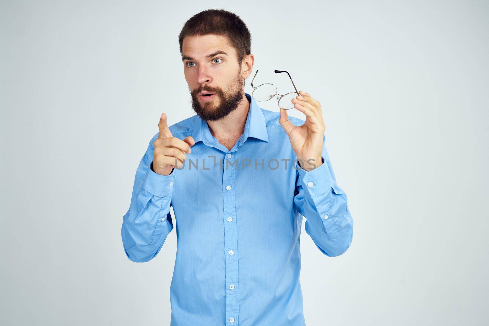 manager wearing glasses posing office work light background. High quality photo