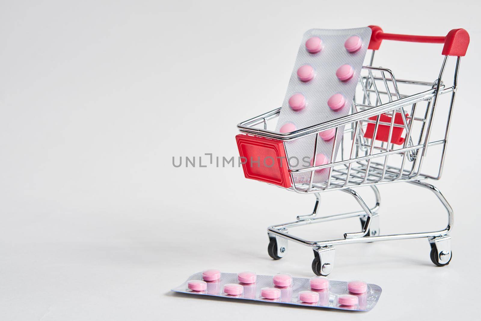 drug trolleys pharmacy shopping light background pharmacy. High quality photo