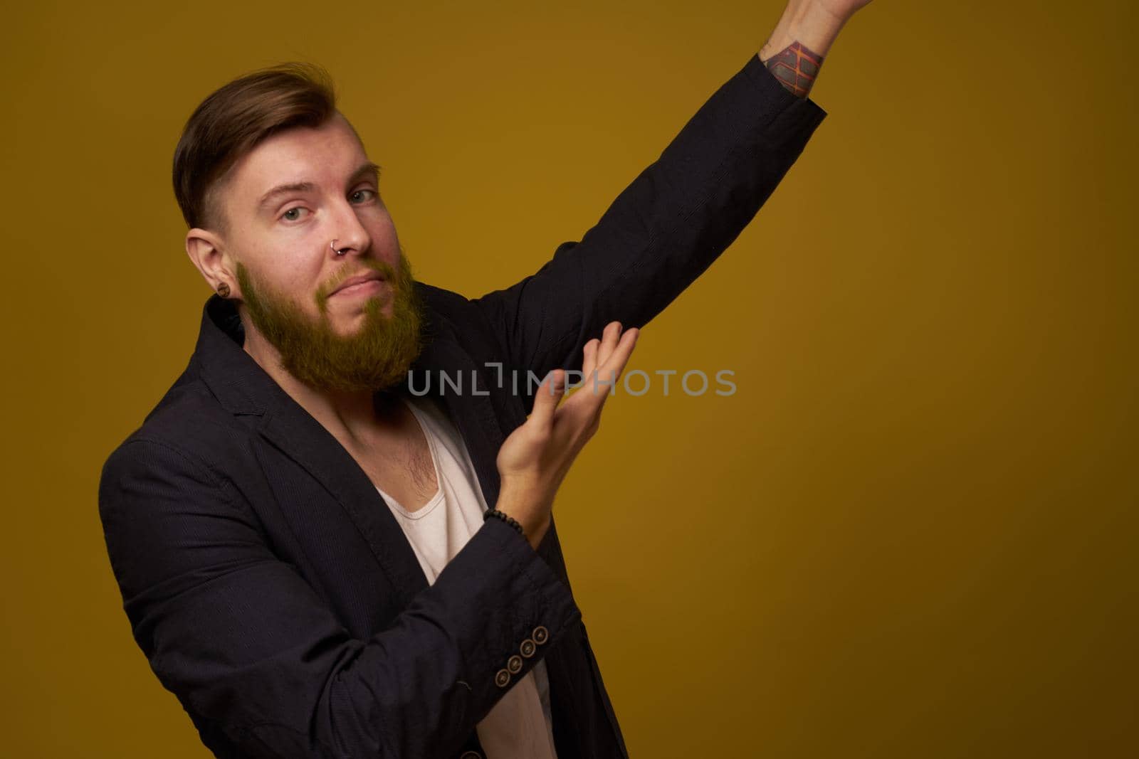 bearded man fashionable hairstyle jacket posing self confidence. High quality photo