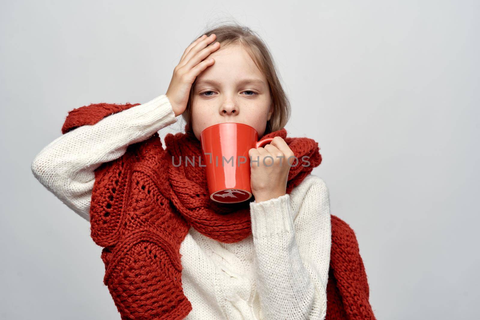 girl with a cold covered herself with a blanket health problems flu. High quality photo