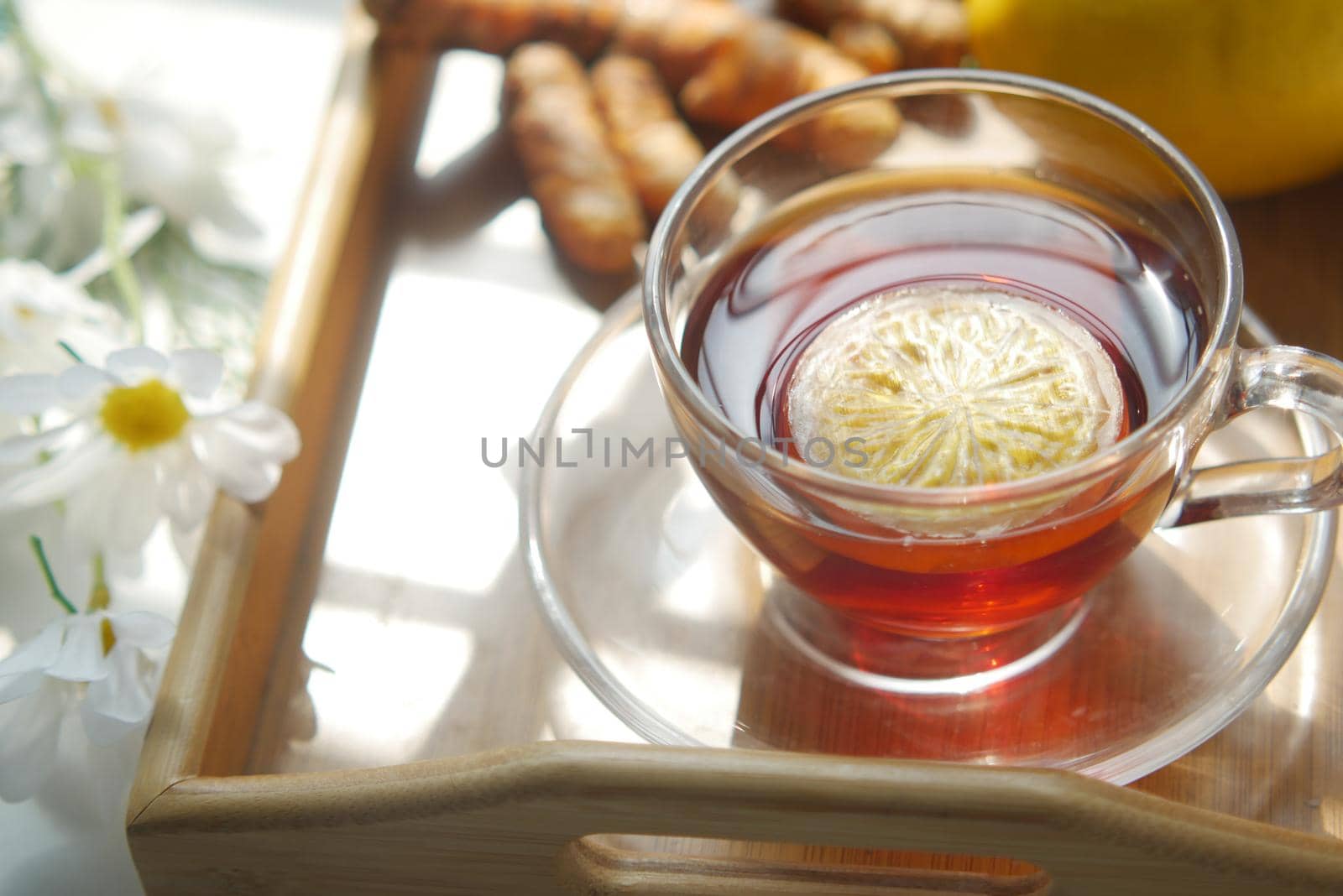 Top view of ginger tea on wooden background..