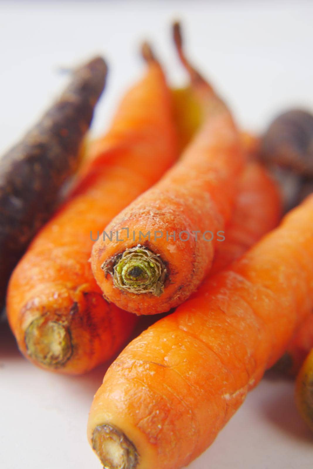 mixed colorful carrot on table close up .