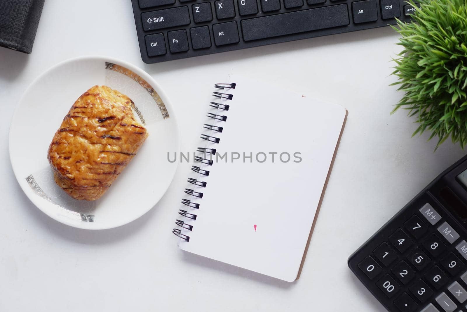 high angle view of open notepad on black background.