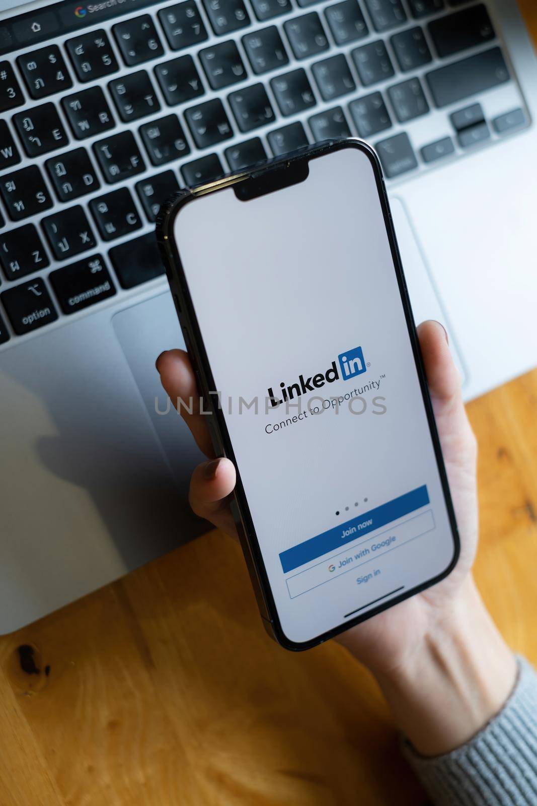 CHIANG MAI, THAILAND: OCT 18, 2021: LinkedIn logo on phone screen. LinkedIn is a social network for search and establishment of business contacts. It is founded in 2002. by itchaznong