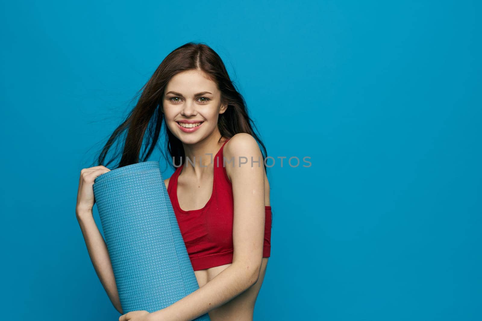 cheerful sportswoman sport equipment training isolated background by Vichizh