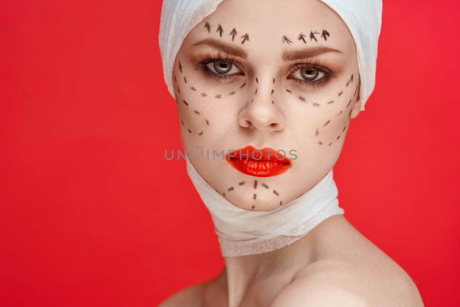 beautiful woman posing in blue gloves red lips surgery facial rejuvenation studio lifestyle. High quality photo