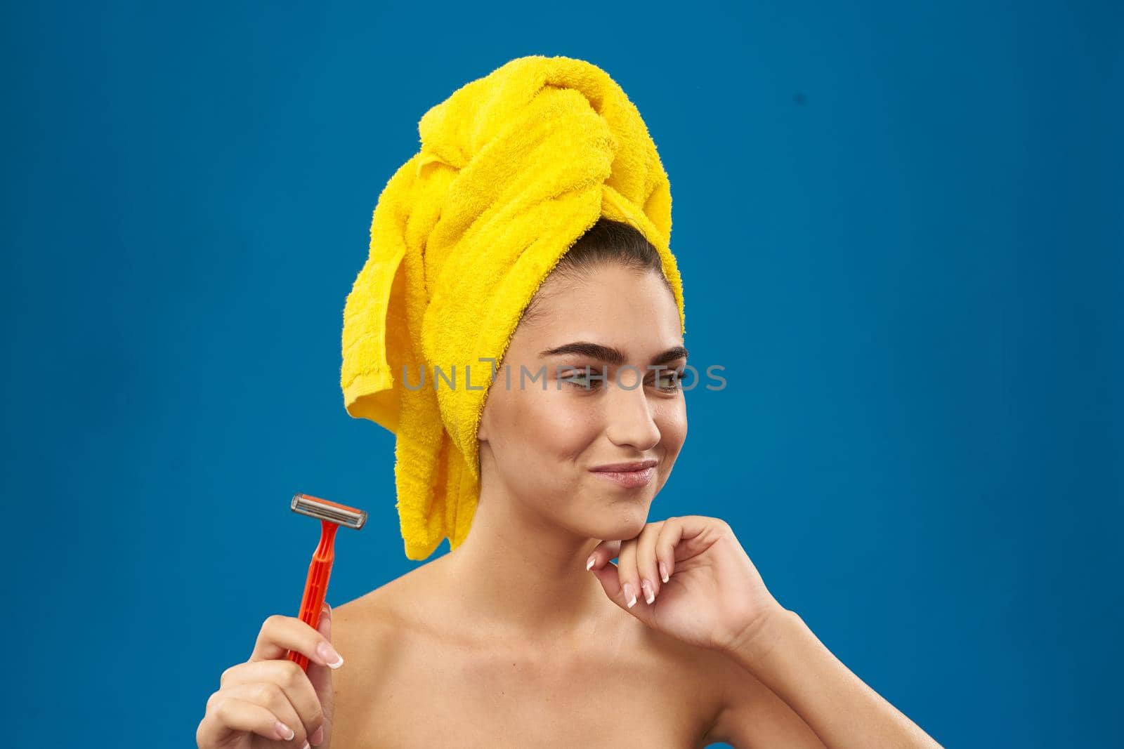 pretty woman razor in hand skin care hygiene blue background by Vichizh