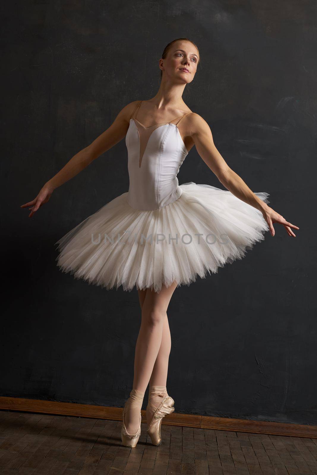 woman ballerina in white tutu performance grace dance. High quality photo