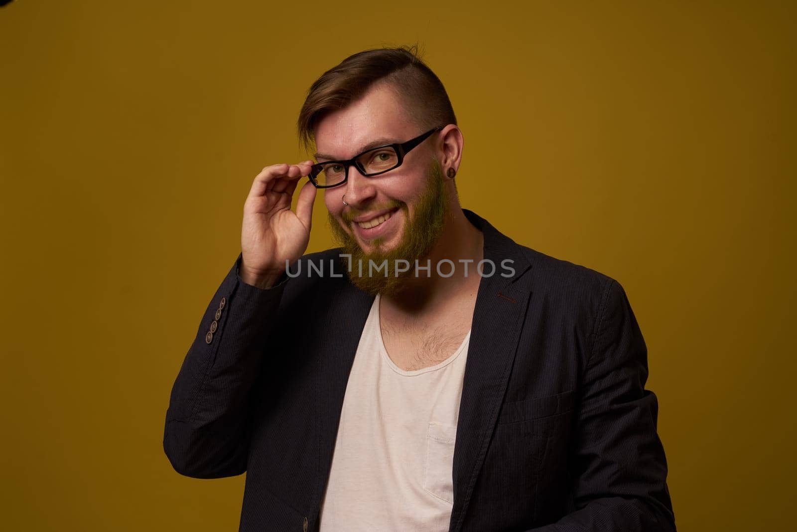 bearded man in a black jacket with a book in his hands education. High quality photo