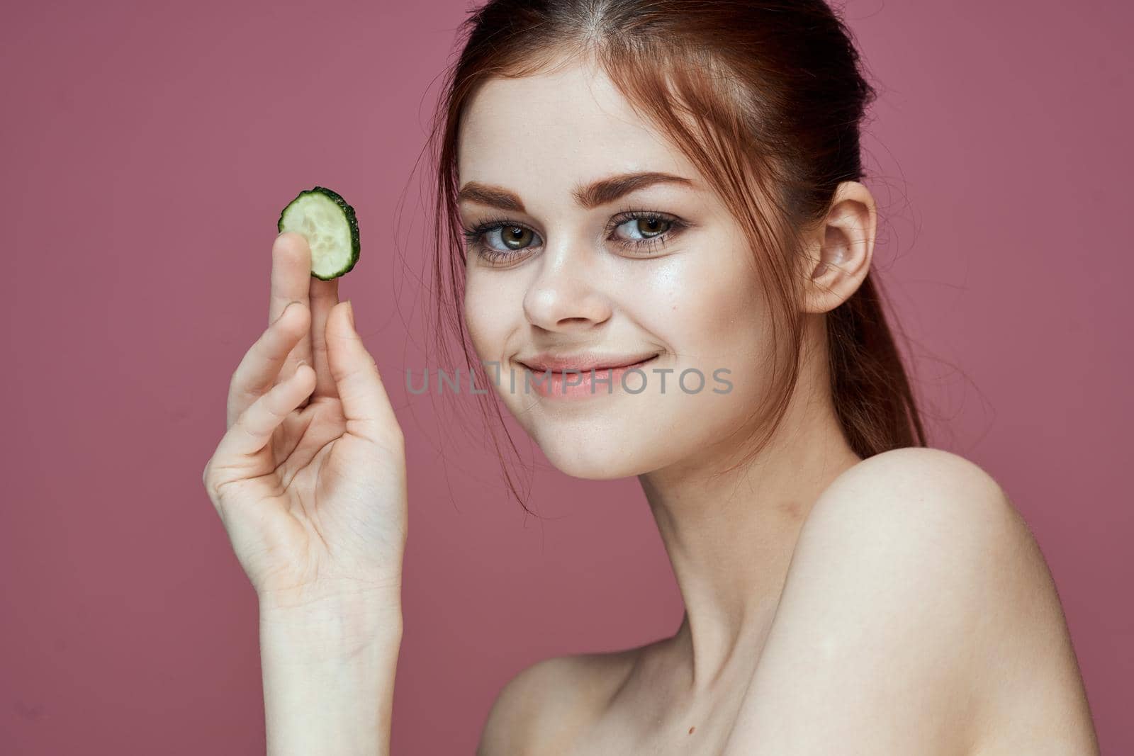 cheerful woman cucumbers vitamins clean skin health. High quality photo