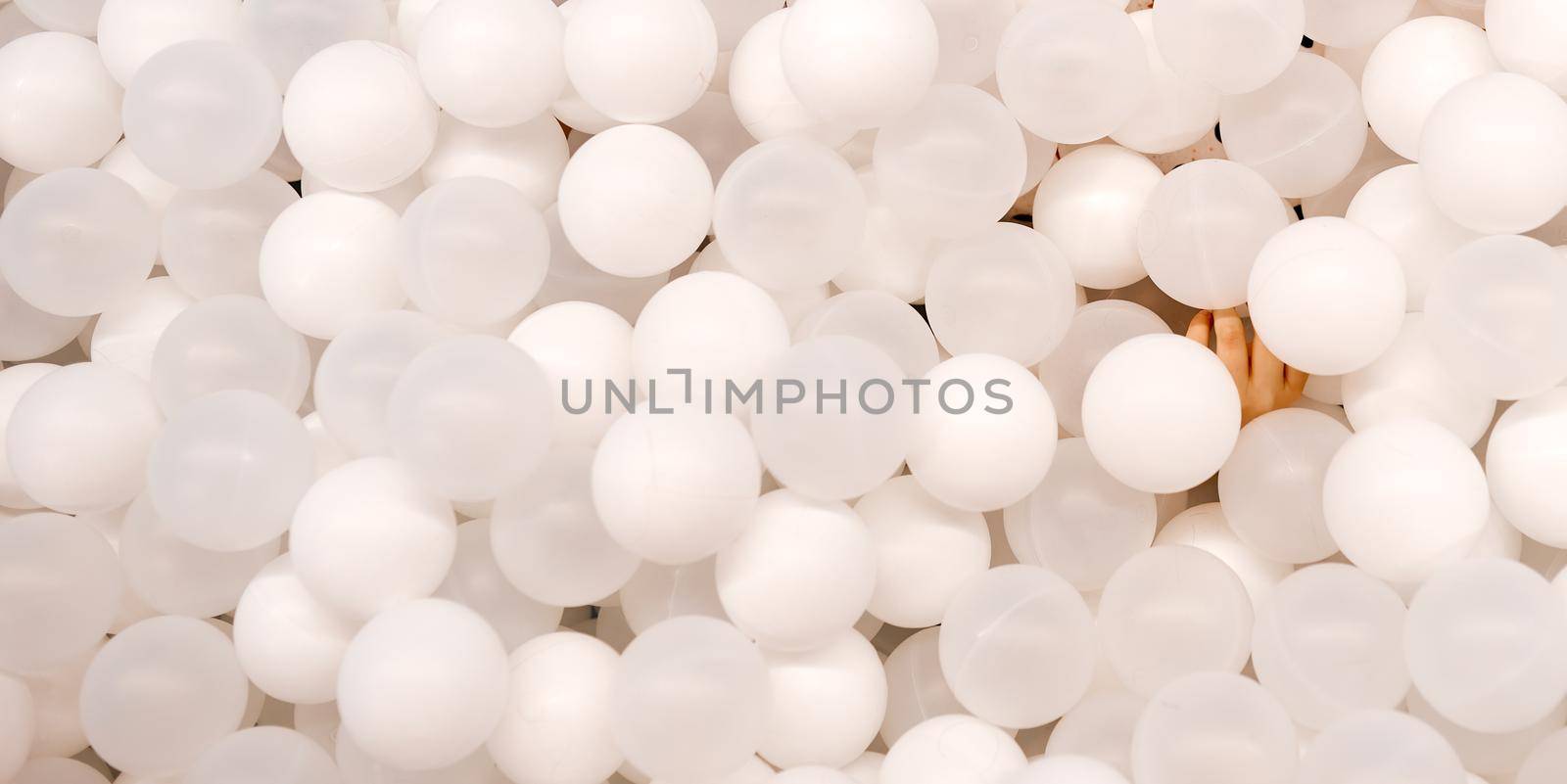 A lot of white balloons for background use with child without face by AntonIlchanka