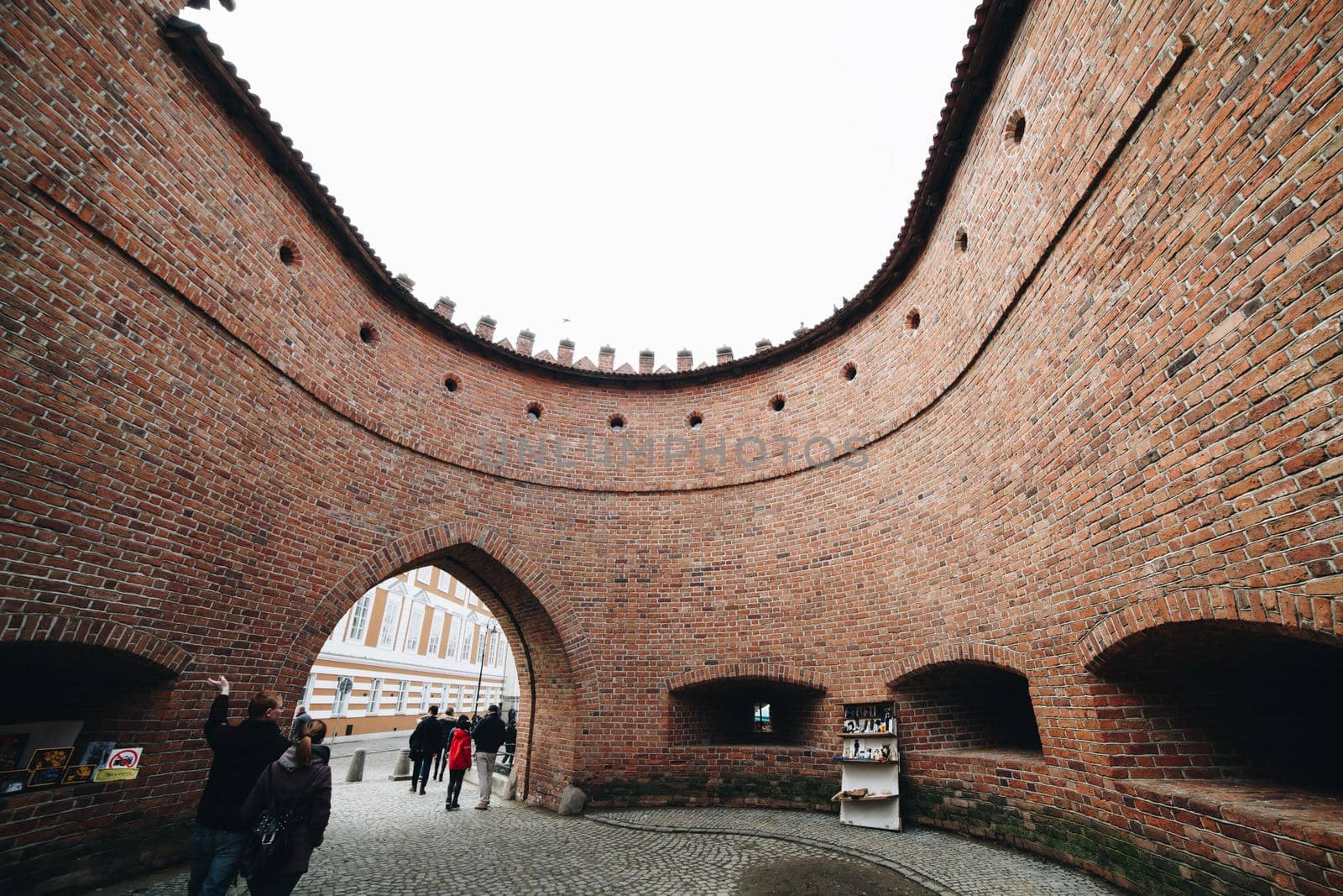 WARSAW, POLAND - Mar, 2018 Tourist looking the The Old Town, Warsaw, Poland - Medieval Age.