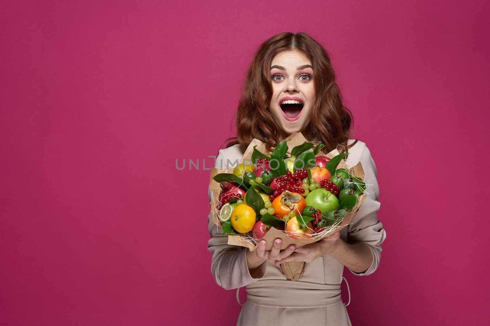 beautiful woman fashionable hairstyle bouquet of flowers decoration pink background. High quality photo