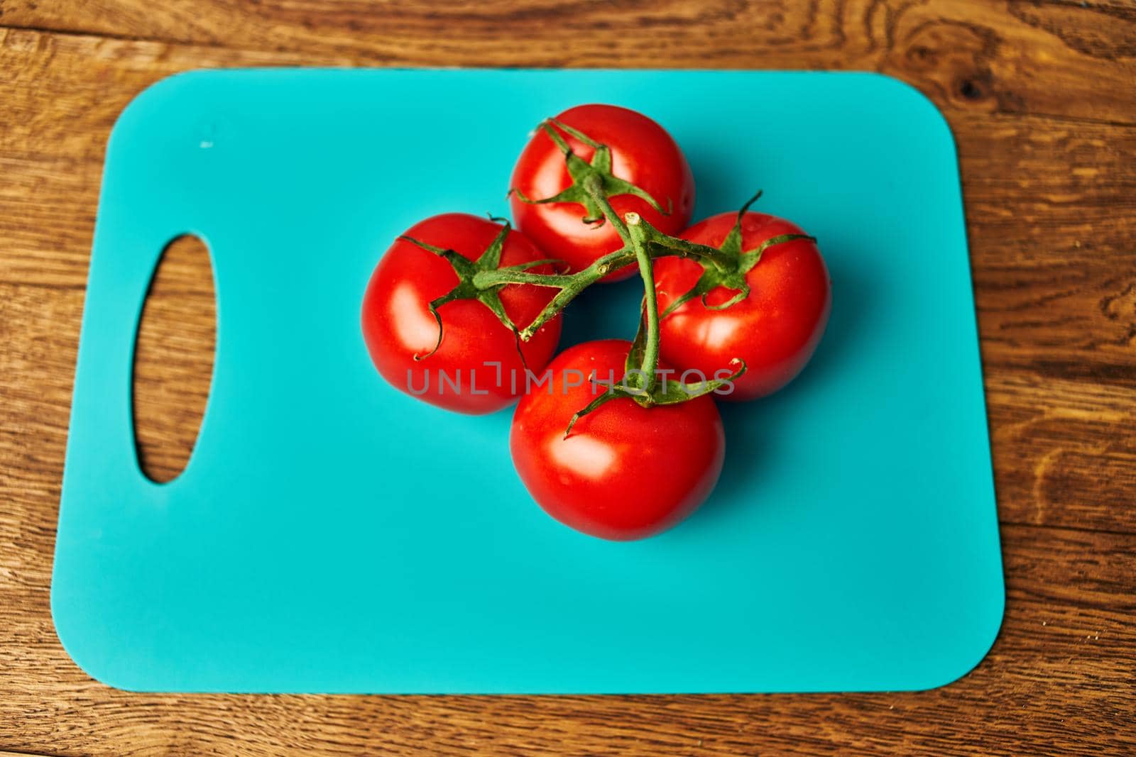 vegetables kitchen cooking salad red tomatoes wood background. High quality photo