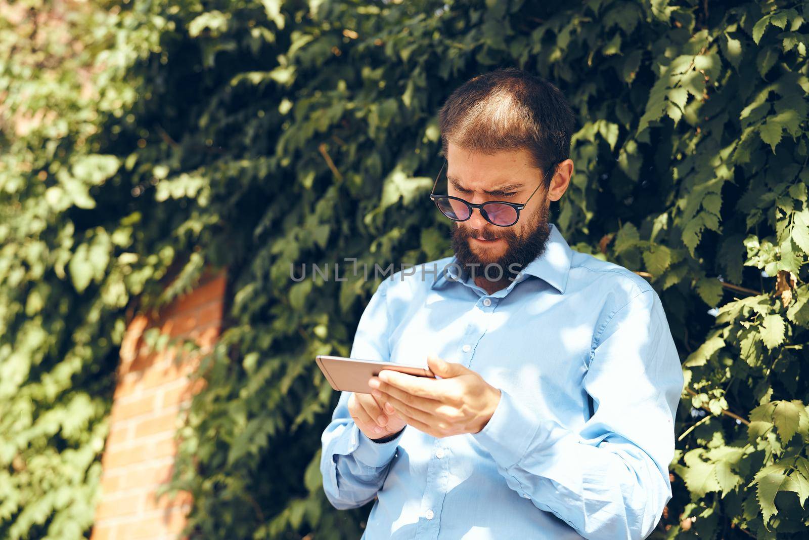 business man with phone outdoors communication lifestyle by Vichizh