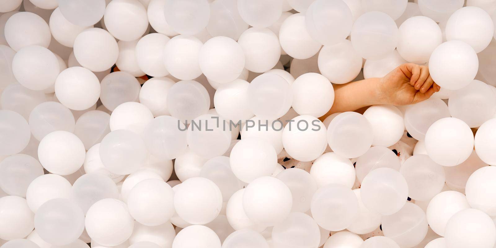 A lot of white balloons for background use with child without face. High quality photo