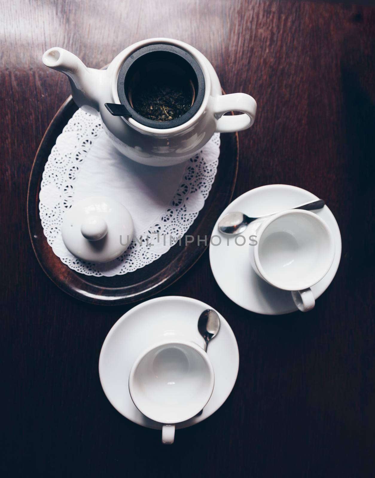 Aerial view of a table with desserts and tea.