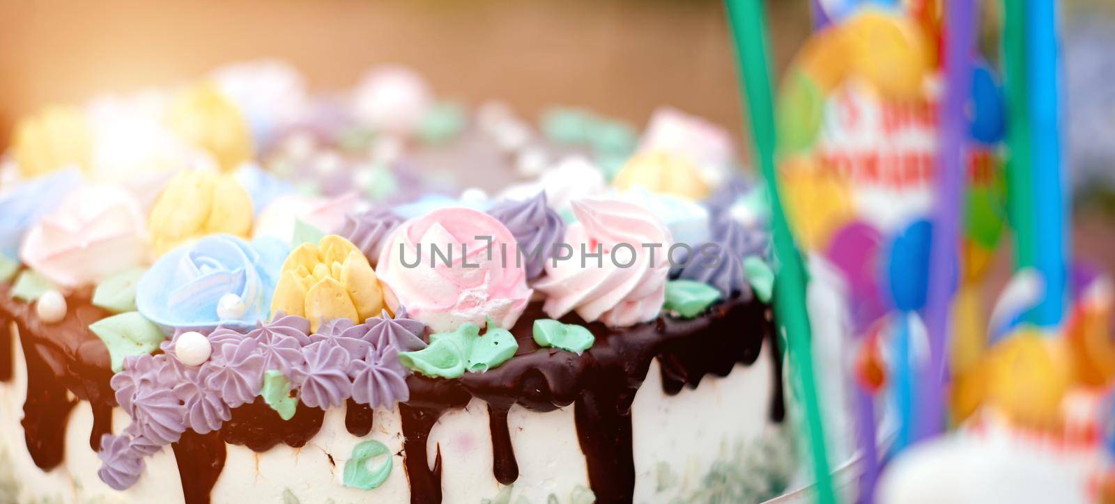 very delicious beautiful cake with cream roses and chocolate cream . High quality photo