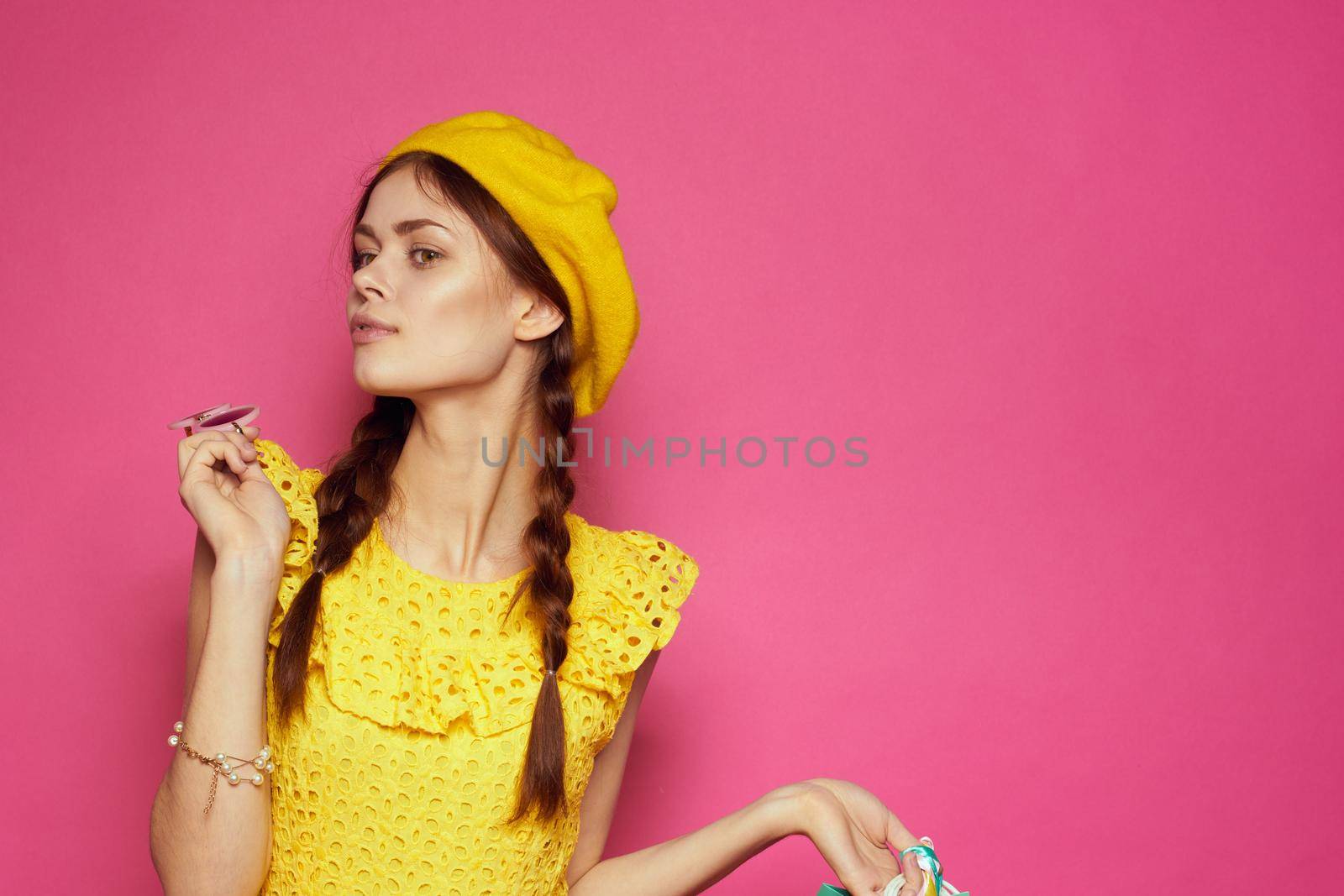 smiling woman wearing sunglasses posing shopping fashion studio model by Vichizh