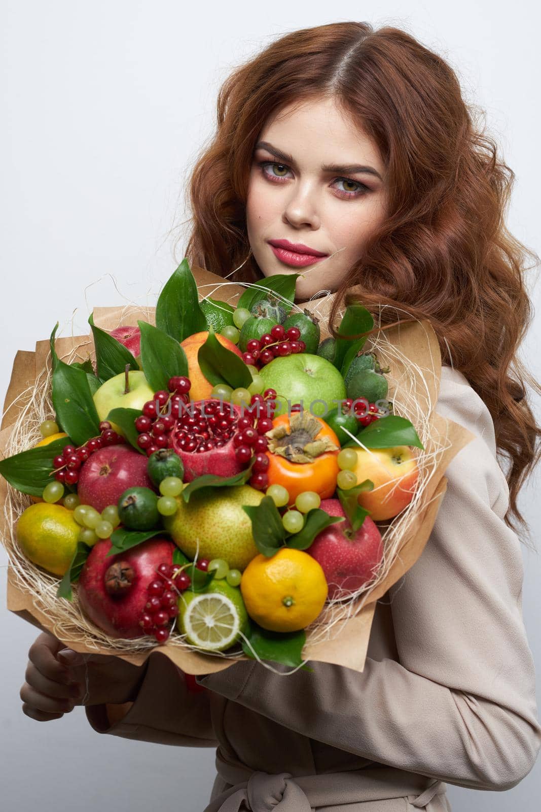 beautiful woman fashionable hairstyle bouquet of flowers decoration light background. High quality photo