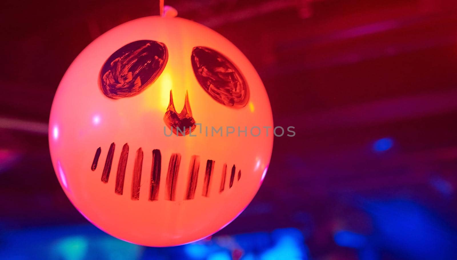 glowing balloon inflatable ball featuring a cheerful skull . High quality photo
