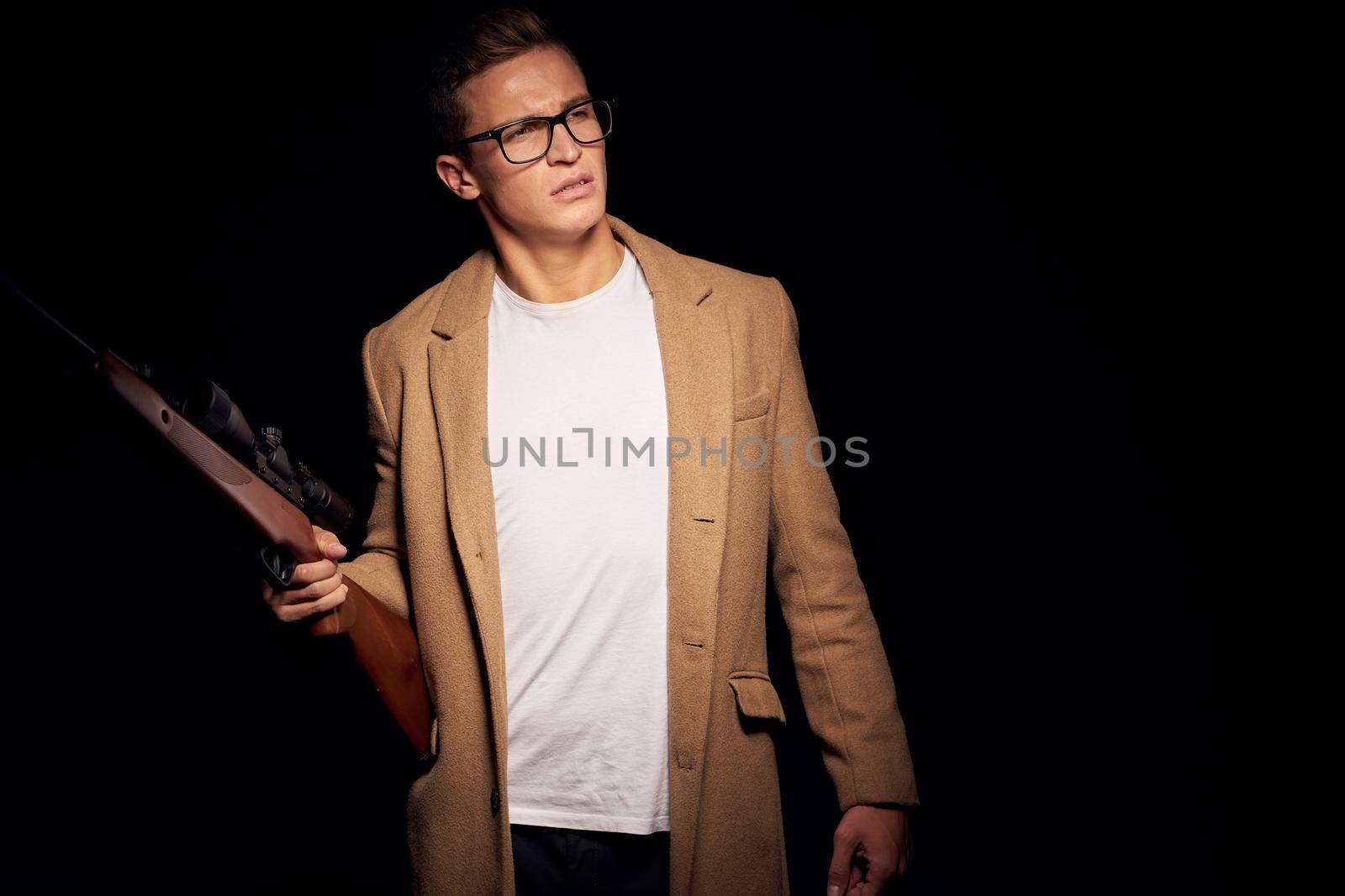 a person gun shooting killer mafia isolated background. High quality photo