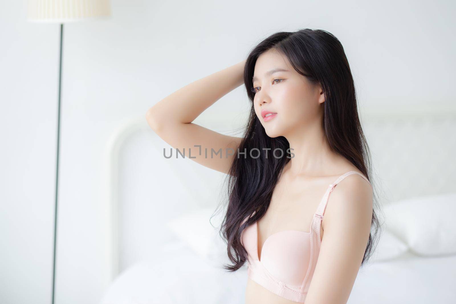 Beautiful portrait young asian woman sexy in underwear figure fit relax with seductive in bedroom, beauty asia girl body slim in lingerie confident and happy stand in bedchamber, lifestyle concept. by nnudoo