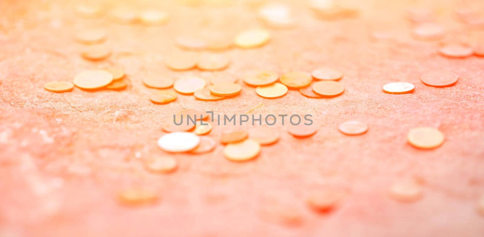 lots of coins. scattered on the ground at sunset. Placer. Thrown. High quality photo