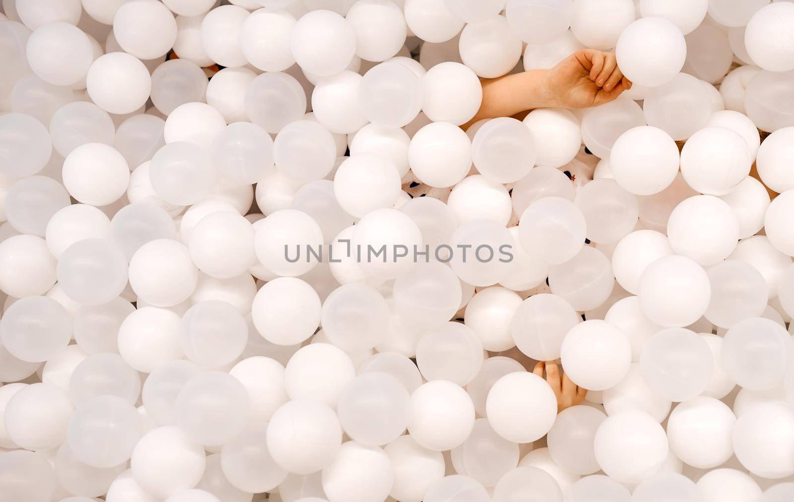A lot of white balloons for background use with child without face by AntonIlchanka