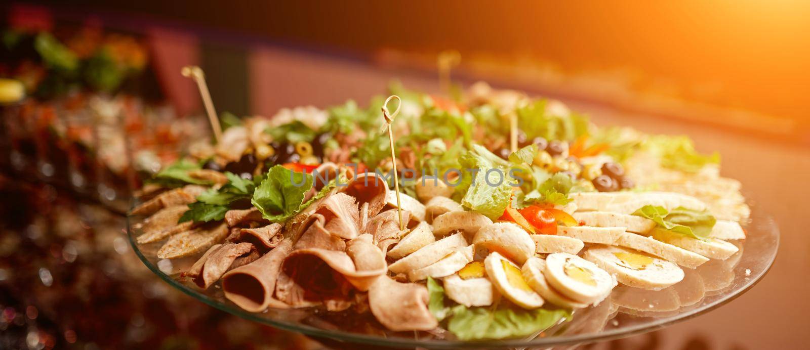 glass tray on a stand with meat and boiled chopped eggs . High quality photo