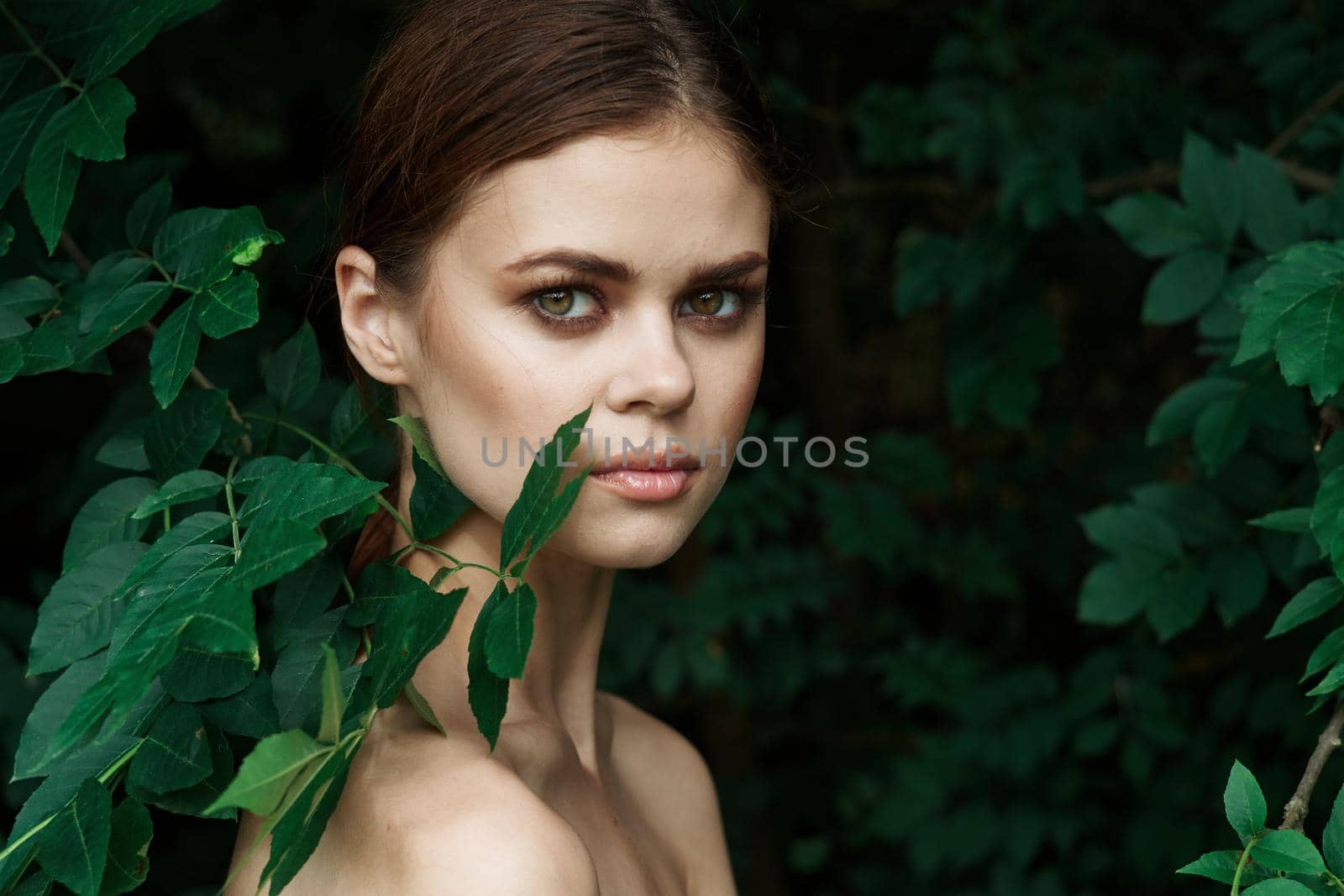 portrait of a woman green leaves clean skin nature summer close-up by Vichizh