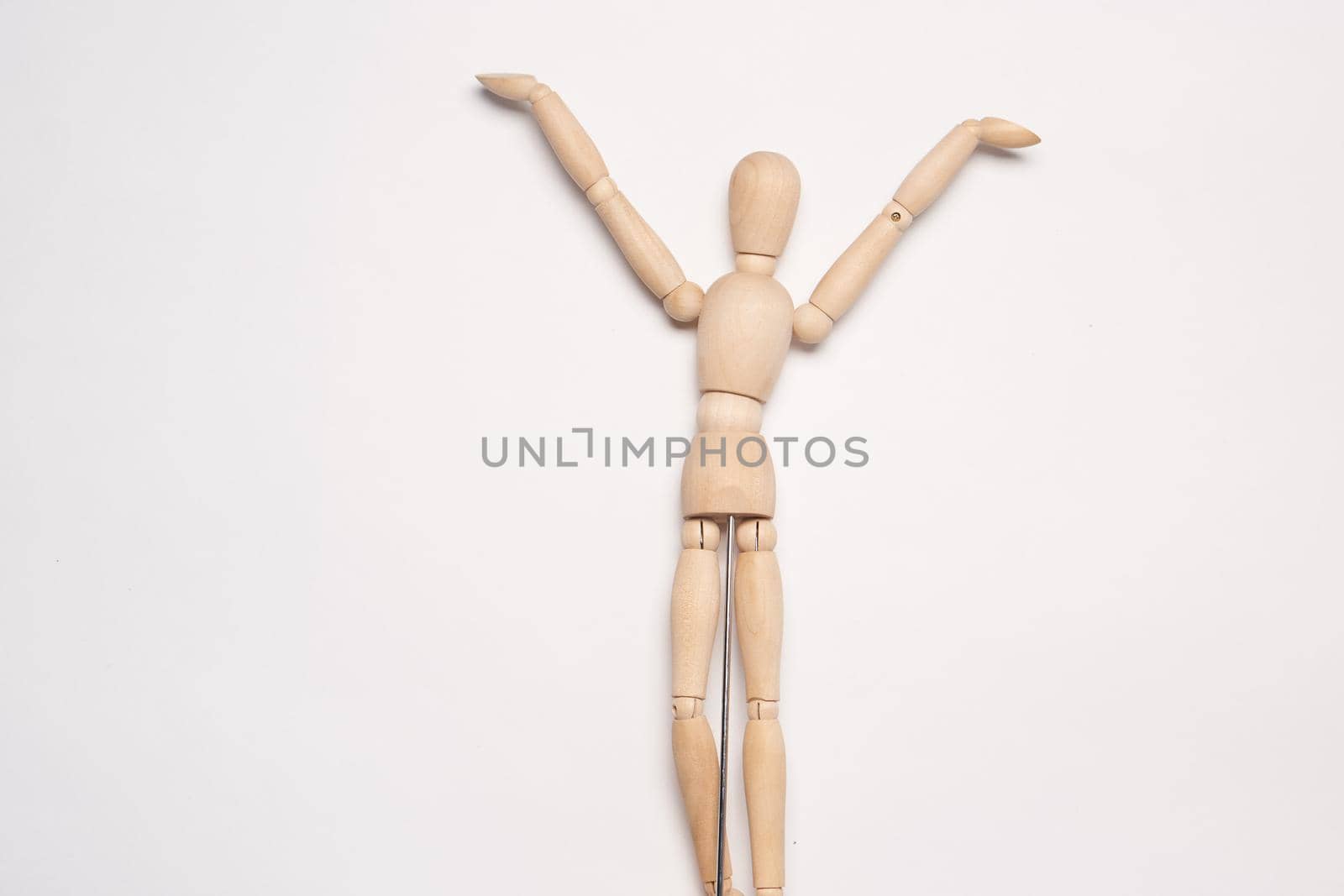 wooden mannequin object light background posing. High quality photo