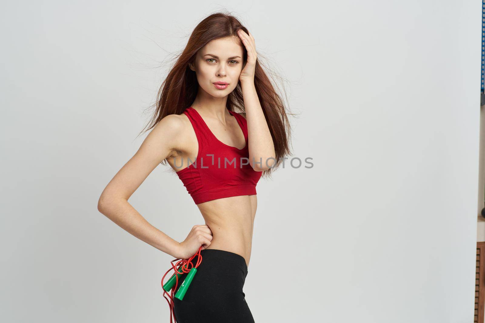 cheerful sportswoman workout exercise gym isolated background. High quality photo