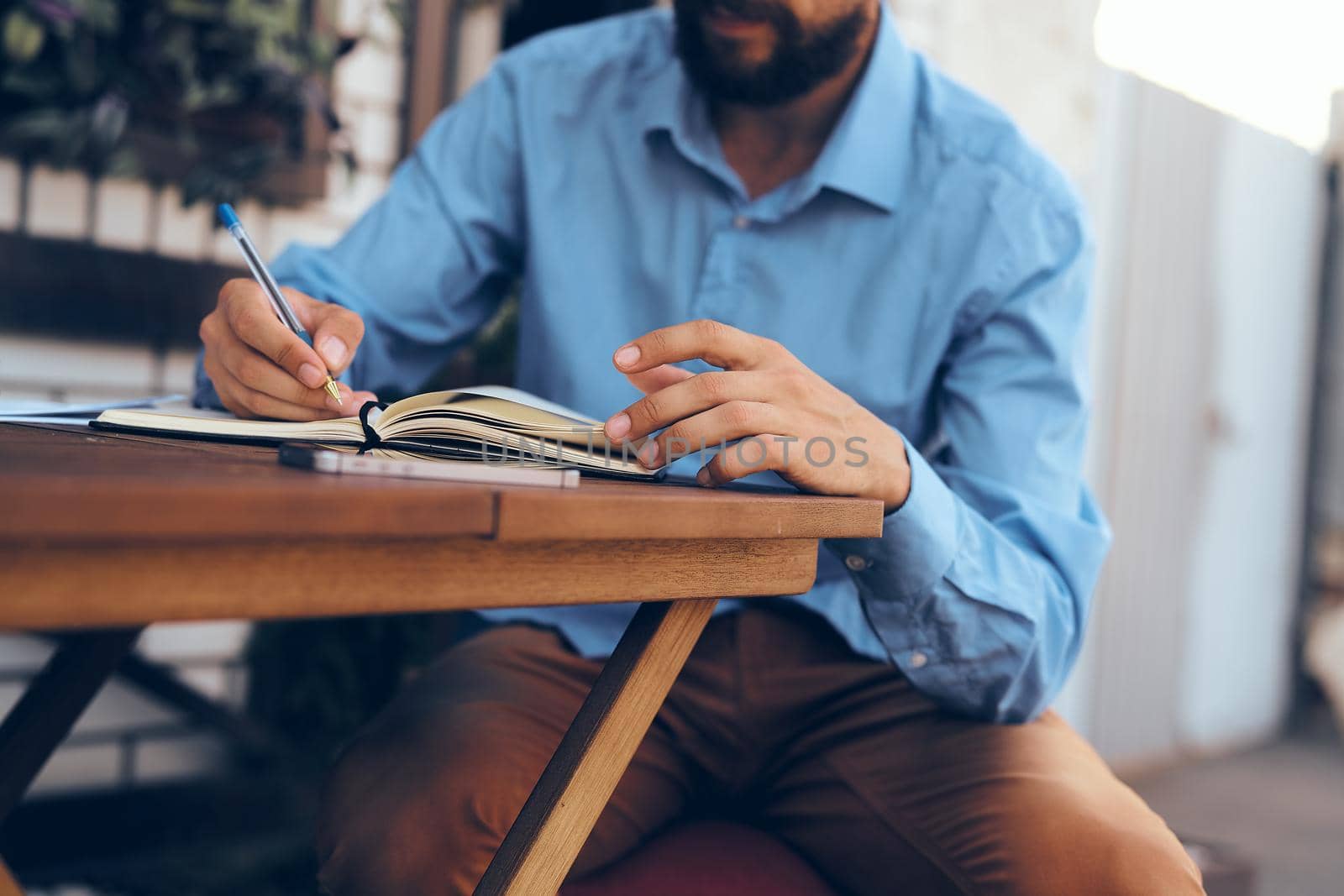 business man in a summer cafe work communication technology by Vichizh