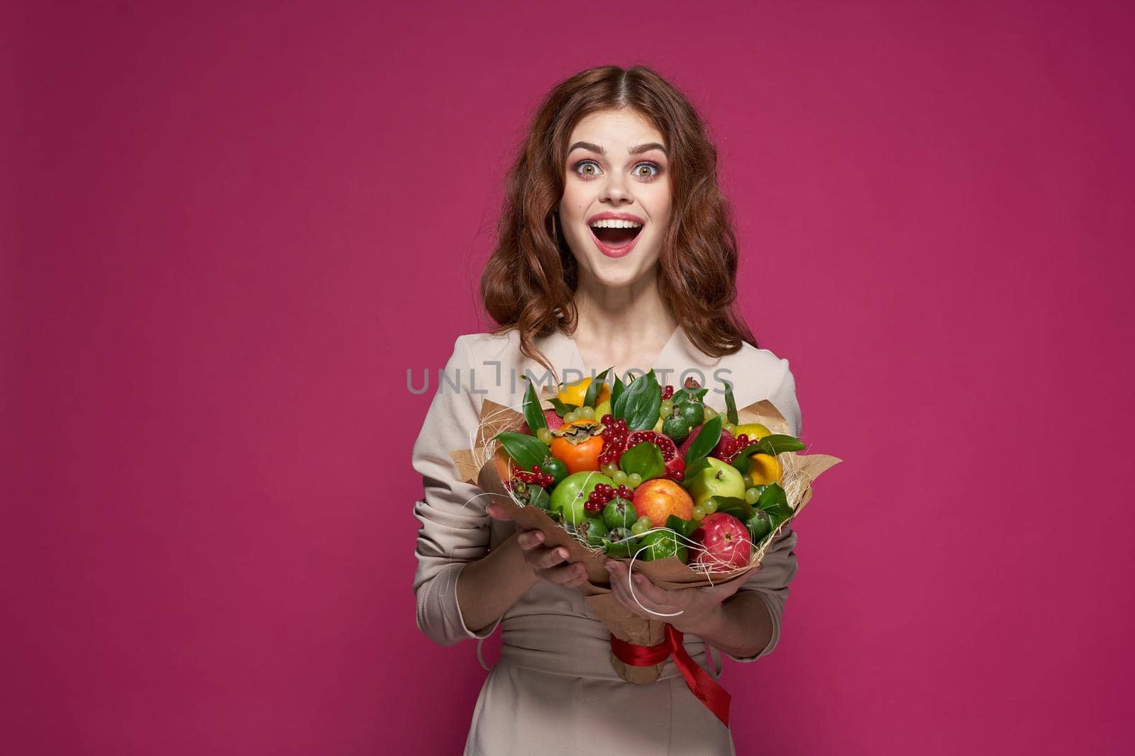 pretty woman smile posing fresh fruits bouquet emotions Studio Model. High quality photo