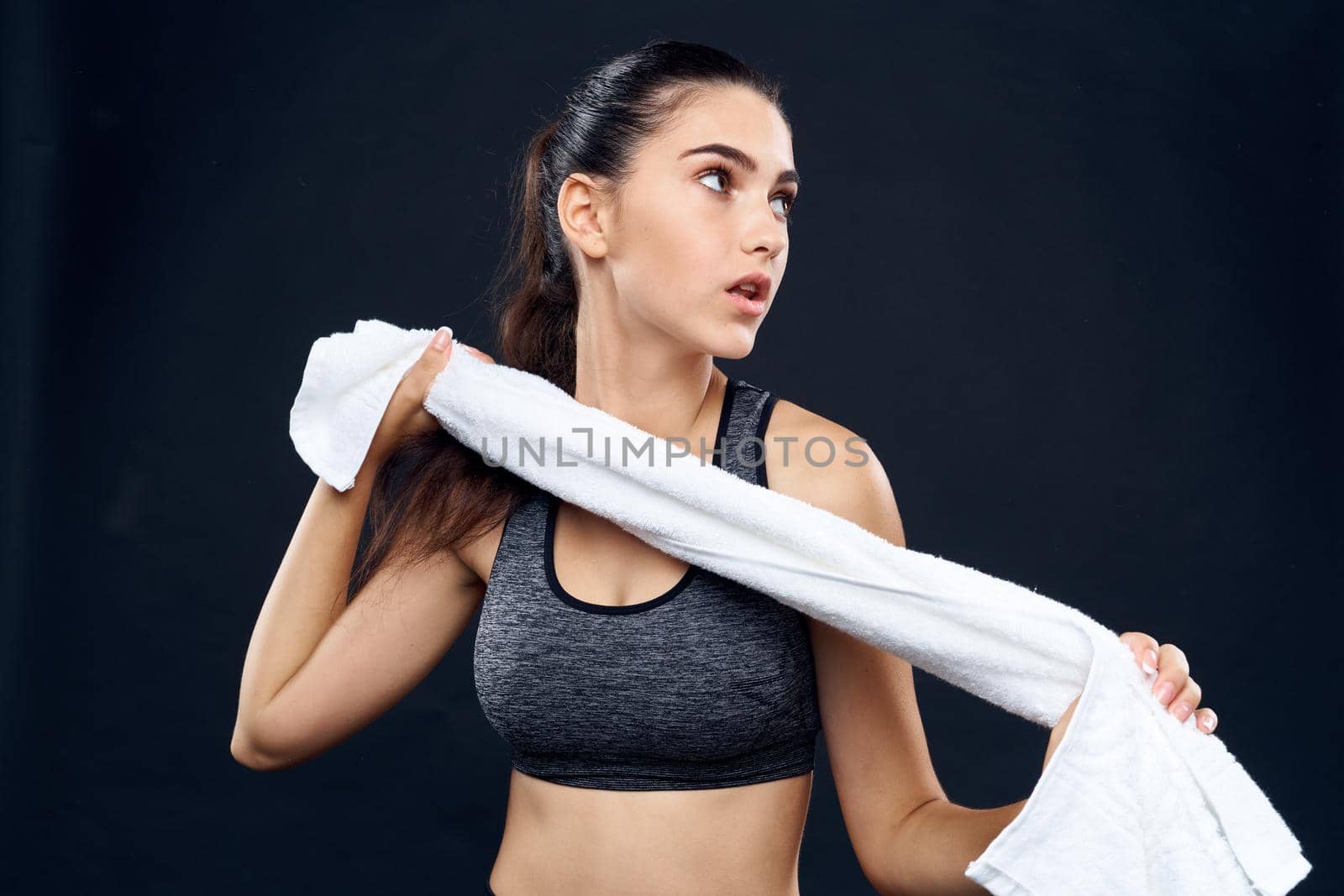 cheerful sports woman slim figure white towel in her hands by Vichizh