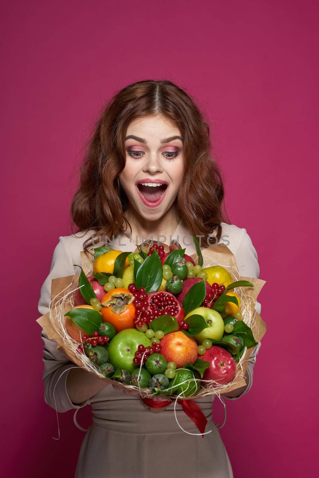 cheerful woman smile posing fresh fruits bouquet emotions Studio Model. High quality photo