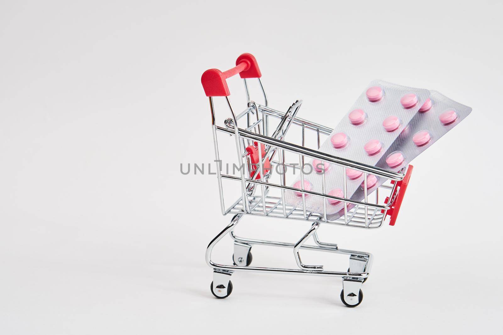 drug trolleys pharmacy shopping light background pharmacy. High quality photo