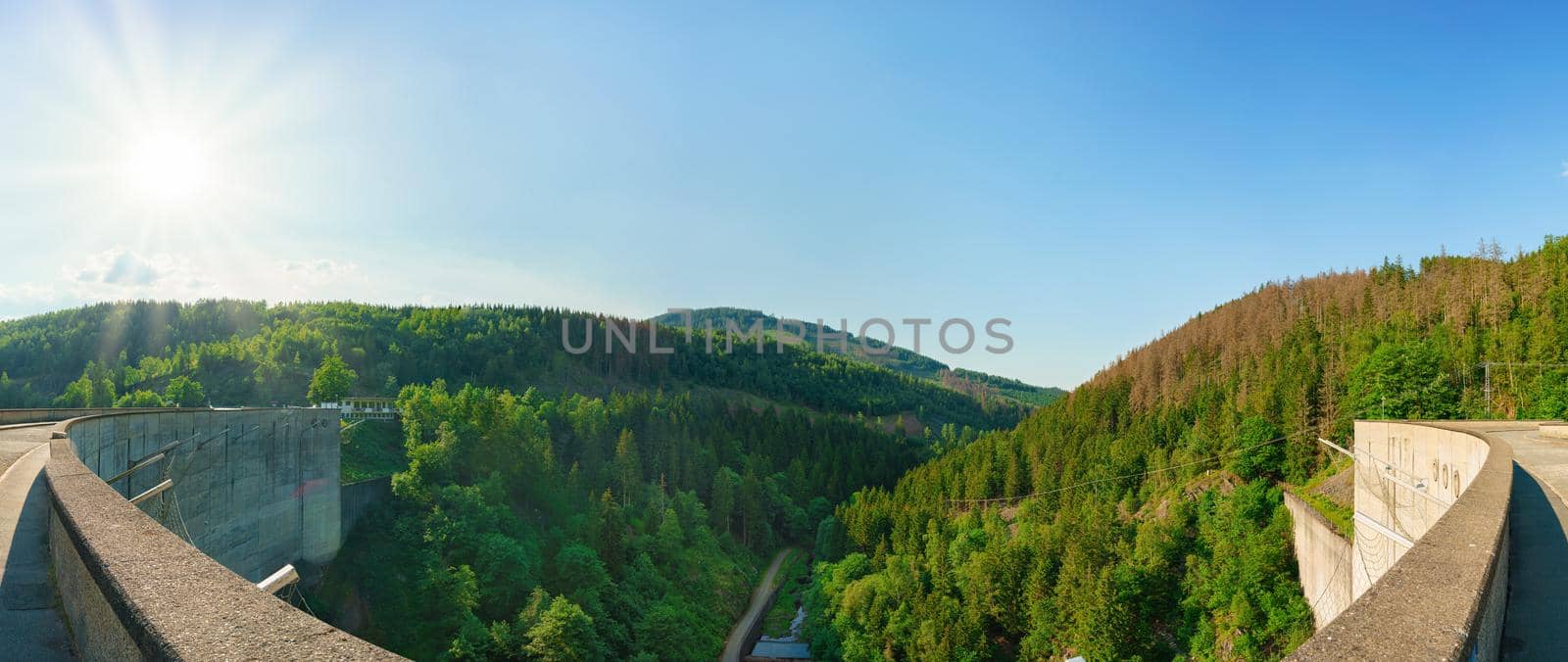 Panorama view of a dam in Germany in summer with blue sky an