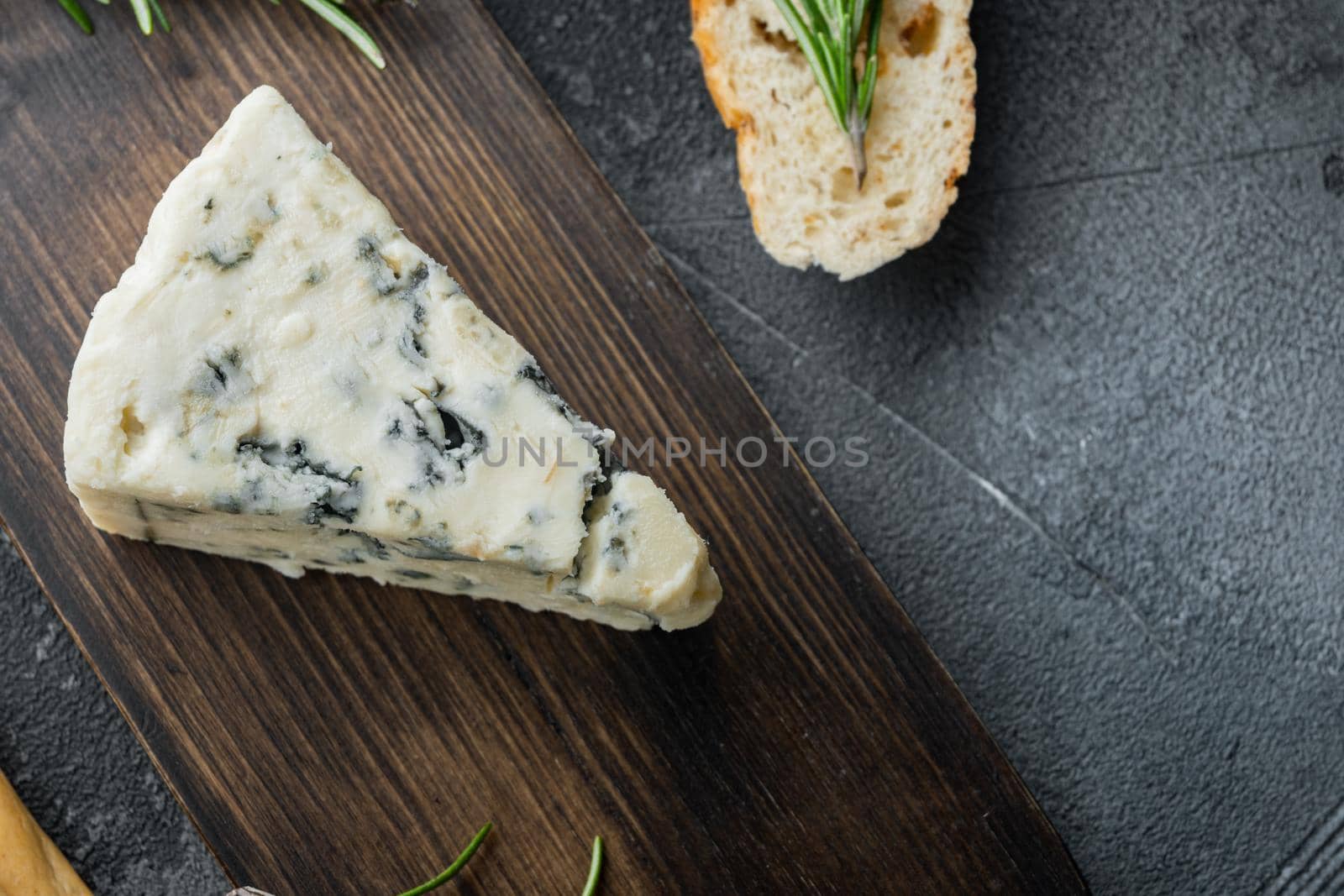 Piece of gorgonzola cheese set, on gray background, flat lay with copy space for text