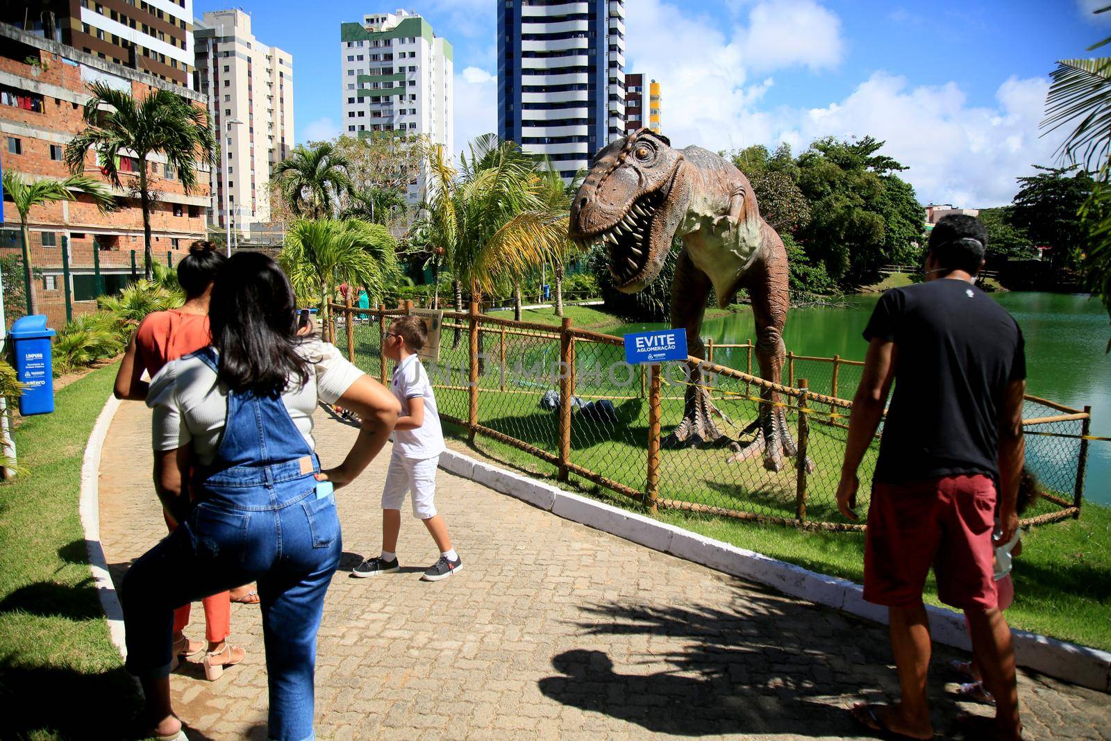 dinosaur sculpture in park by joasouza