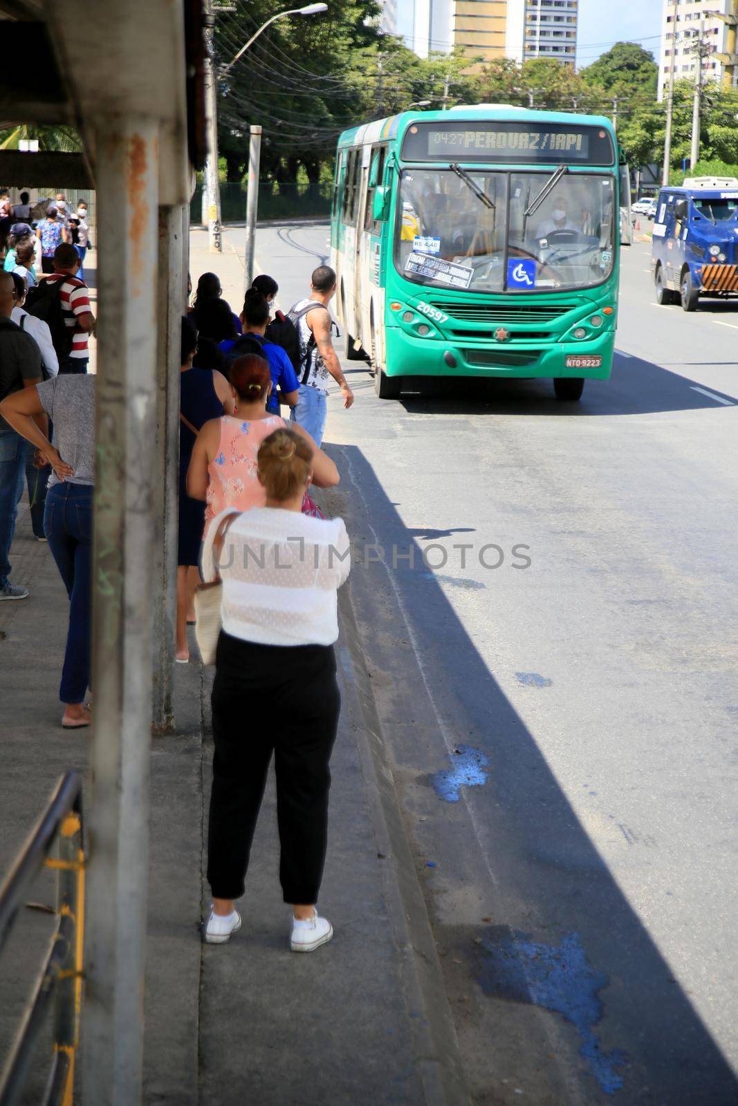  passengers are seen waiting for public transport buses by joasouza