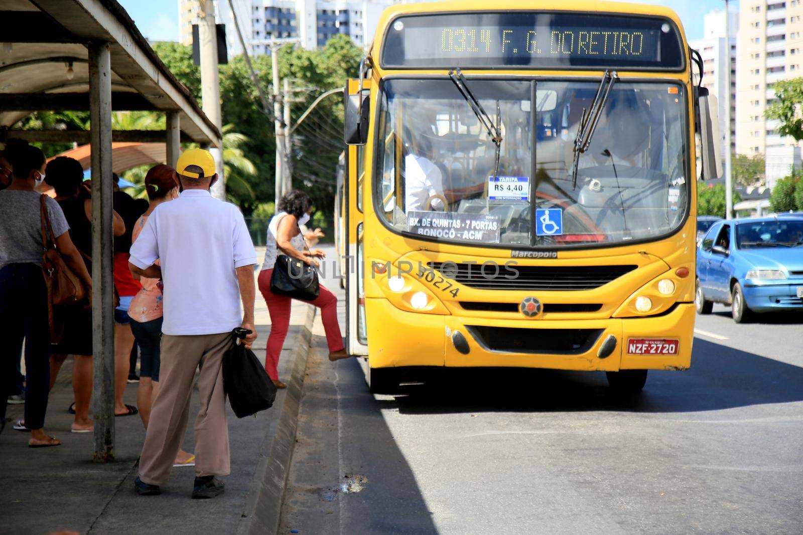 salvador, bahia, brazil - july 20, 2021: passengers are seen waiting for public transport buses at a bus stop in the city of Salvador.