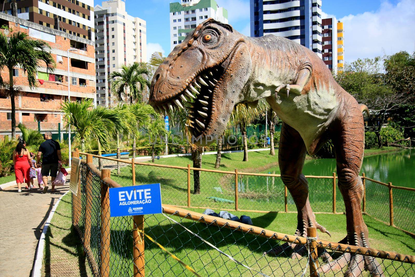 dinosaur sculpture in park by joasouza